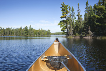 Canoe with fishing net on northern Minnesota lake