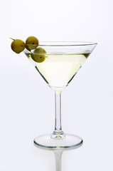 glass martini with olive  light background