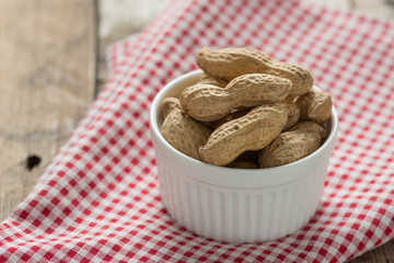Peanut in white bowl.