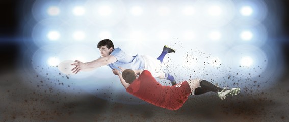 Obraz na płótnie Canvas Composite image of a rugby player scoring a try