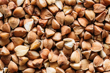 Close Up Dry Buckwheat Grains Background. Healthy Food