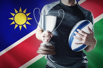 Composite image of midsection of successful rugby player