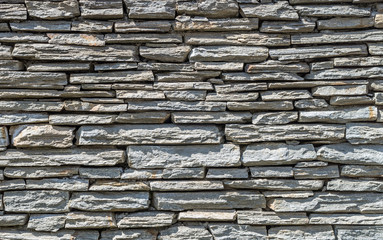 Rough grey stone wall