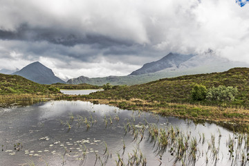 Obraz premium Fiary pools and cloud covered Cuillins of the Isle of Skye