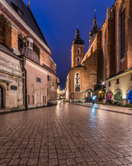 Fototapeta na wymiar Krakow, Poland, Mariacki square between St Mary's church and St Barbara's church in the morning