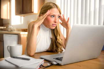 Stress frustrated panic news email reading from laptop computer woman depressed