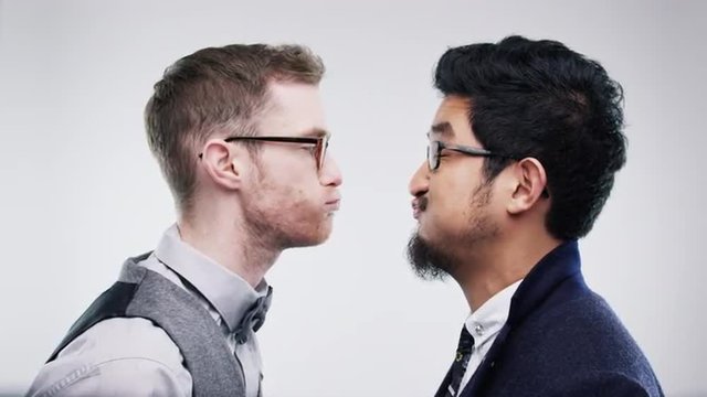 Men pulling funny faces slow motion wedding photo booth series