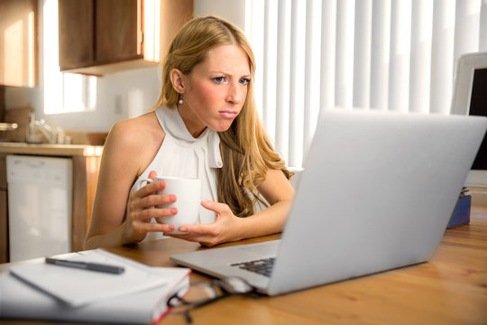 Woman person searching for job unemployed work from home computer morning struggling confused desperate