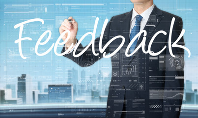 businessman write on transparent board Feedback with city in the