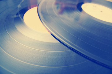 Segment of vinyl record with label showing the texture of the gr