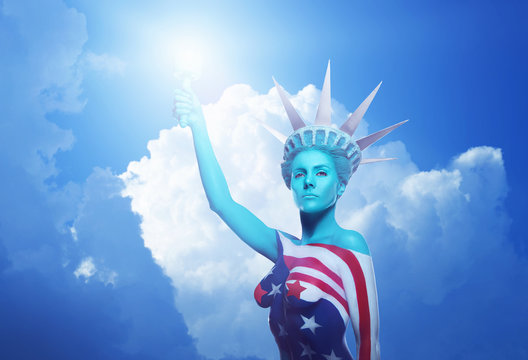 Beautiful woman with american flag. Statue of Liberty. American symbol