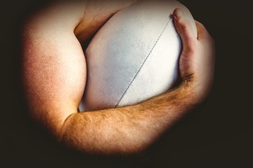 Fototapeta premium Shirtless rugby player holding ball