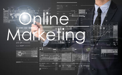 businessman writing Online Marketing and drawing some sketches