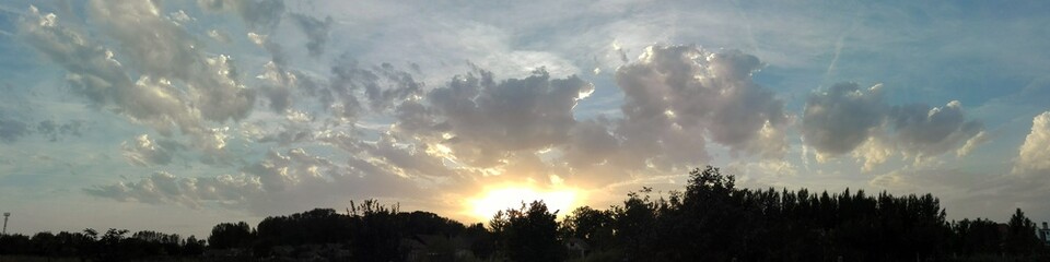 Obraz na płótnie Canvas Sunset Panorama with Dramatic Clouds