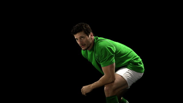 Serious rugby player playing in slow motion