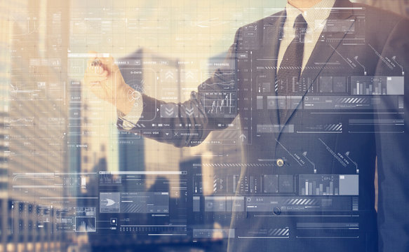 Businessman writing something on virtual screen behind the back