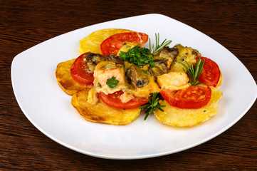 Roasted salmon with potato and tomato