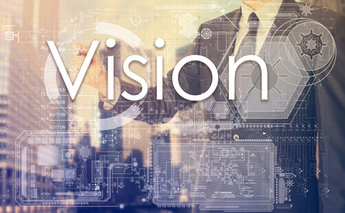 businessman writes on board text: Vision - with sunset over the