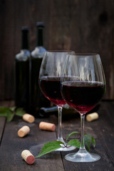 Glass of red wine on old wooden table