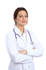 Fototapeta premium Friendly smiling young female doctor, isolated over white background