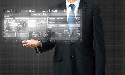 businessman presenting digital graphs on virtual screen