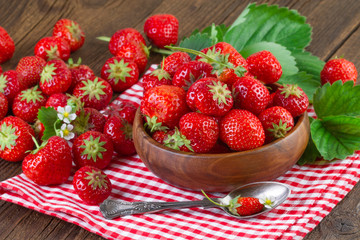 Strawberry on red checkered tablecloth