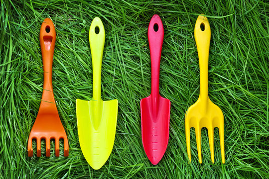 Set of gardening tools on grass