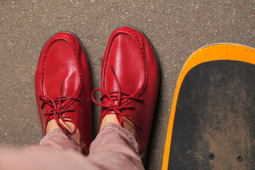 fancy red leather moccasins with laces Lofer on women's legs
