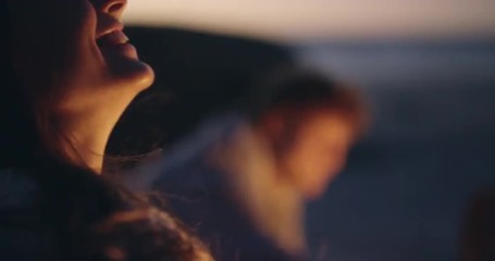 Beach Party at sunset with bonfire and roasting marshmellows with friends - Powered by Adobe