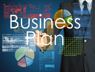the businessman is writing Business Plan on the transparent boar