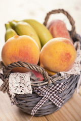 Fruits in a basket on a wooden table