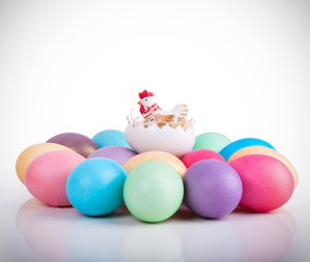 Chicken toy on easter eggs closeup