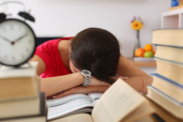 Tired female student at workplace