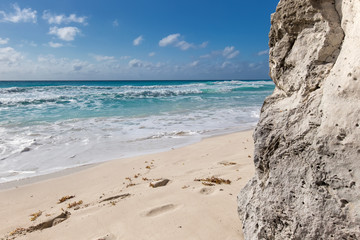 Ocean with waves and rocks on beach