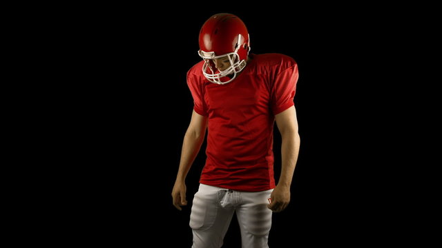 Red american football player posing