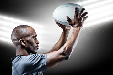 Composite image of athlete in position of throwing rugby ball