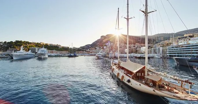 Monaco, Monte-Carlo, 07.09.2015: Port Hercules at sunset, port de Hercule, luxury yachts, big boat, yacht show, mediterranean sea, time-lapse 4k video, motor boat, princes palace of monaco