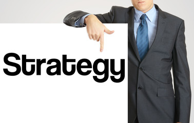 Businessman holding or showing banner with text Strategy