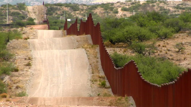 The U.S. Mexico border fence becomes a focal point for immigration issues.