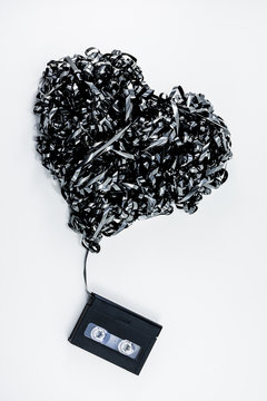 Data Cassette Tape in Shape of Heart Isolated on White Background