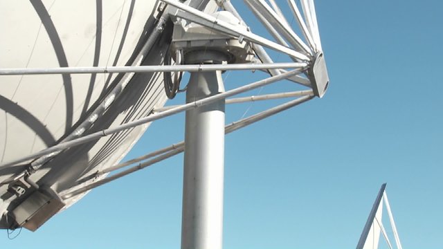 A tilt up to the moon as a satellite searches for extra terrestrial life. 