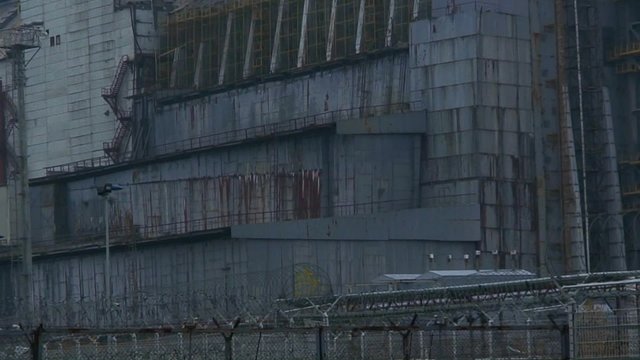 Zoom out from the abandoned nuclear reactor at Chernobyl.