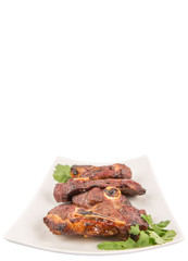 Roasted pieces of lamb on white plate over white background