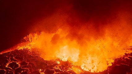 The spectacular Nyiragongo volcano erupts at night in the Democratic Republic of Congo suggests the fire of hell. - Powered by Adobe