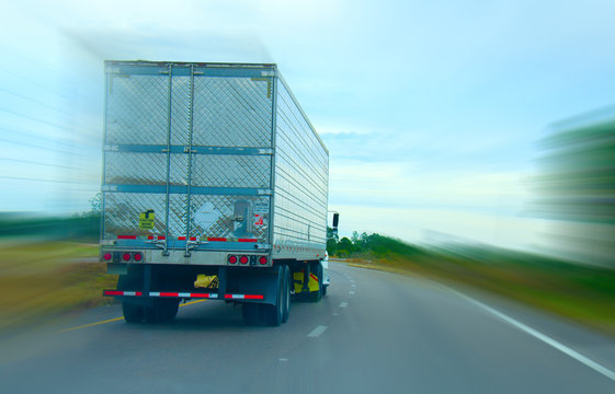 Long Haul Semi Truck Cruising Down The Highway With A Motion Blur Filter Added Creating A Feeling Of Speed.