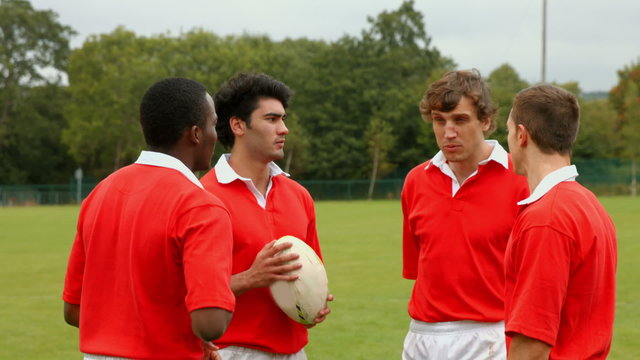 Rugby players chatting together