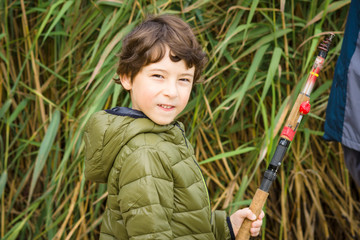 Young boy fishing.