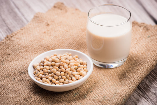Soybeans and soy milk in a glass.