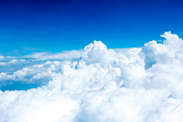 Aerial view of Blue sky and Cloud Top view from airplane window, - obrazy, fototapety, plakaty