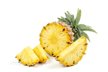 Pineapple with slices on  white background.